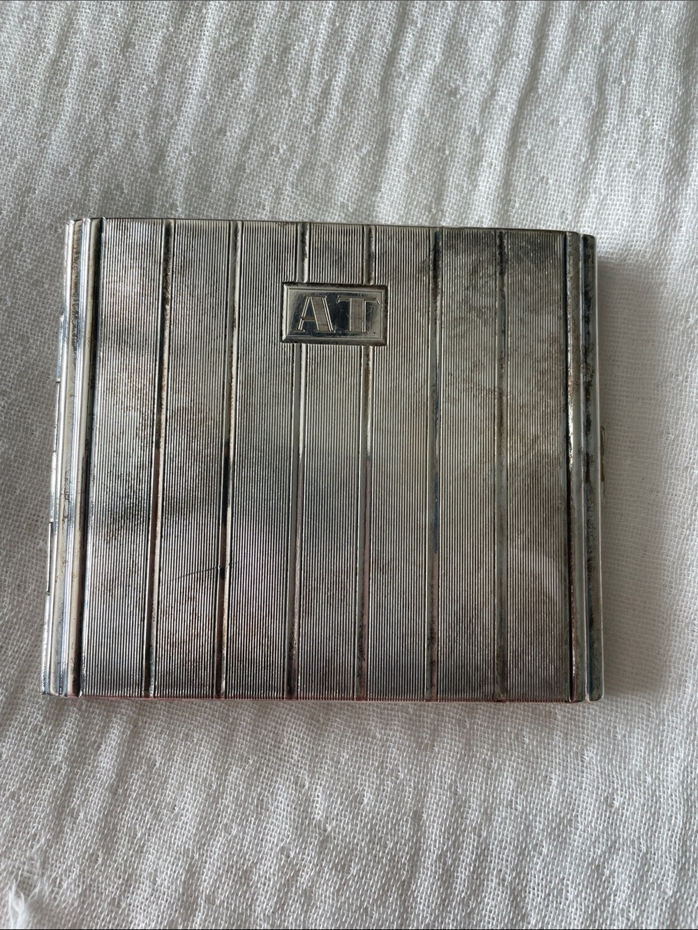 Monogrammed AT Silver plated Cigarette Case, straps aren’t attached but there